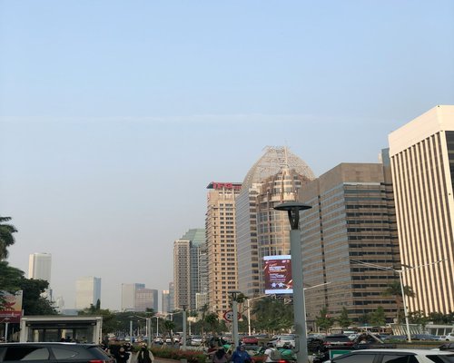 Commuters in Jakarta taking a walk outside an office building