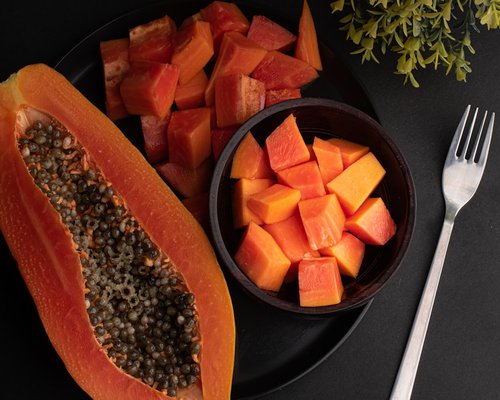 Sliced fresh papaya on a plate ready to eat