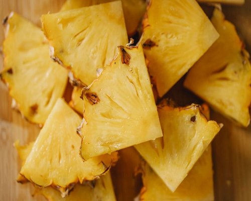 Freshly cut pineapple chunks in a bowl